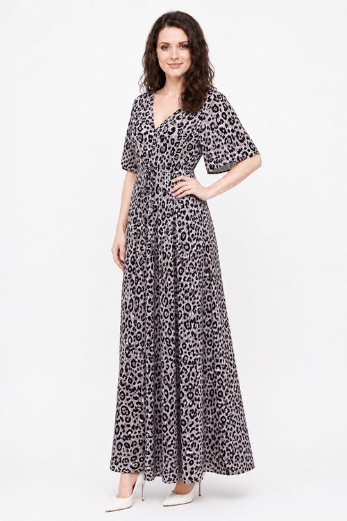 Zena wearing the Avamia River Maxi Dress in a three-quarter view