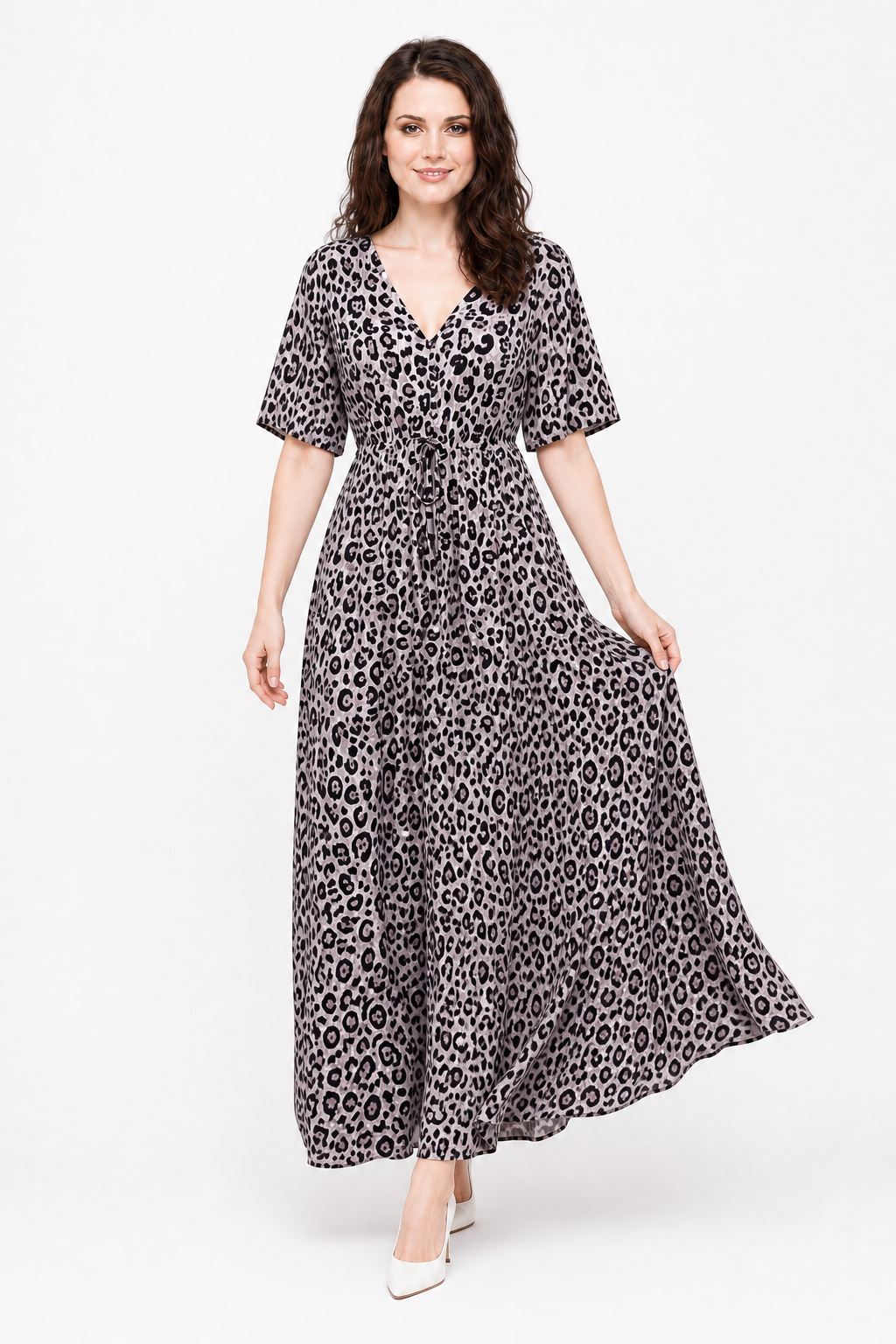Zena walking in the Avamia River Maxi Dress, showing its flowing leopard-print skirt