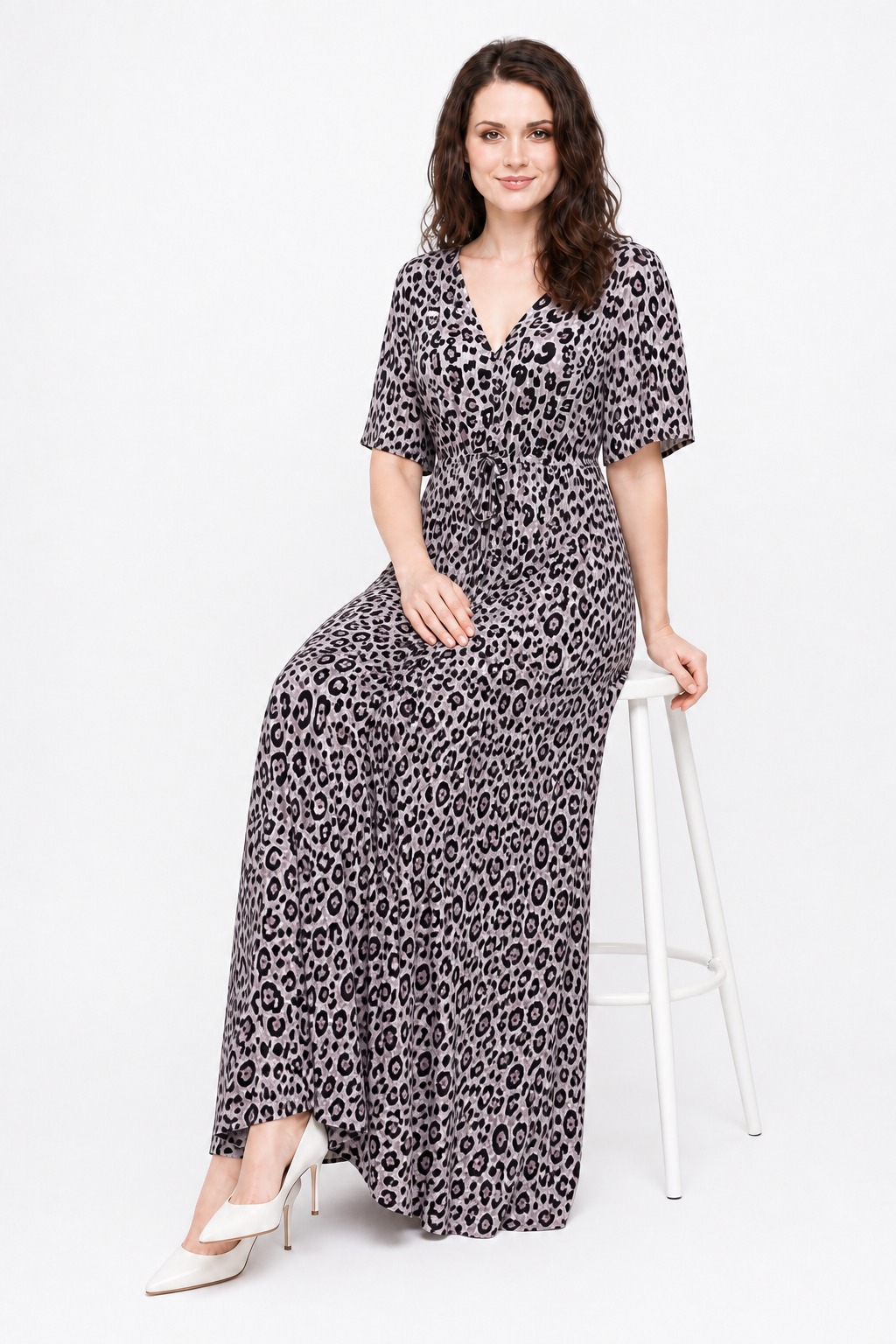Zena seated in the Avamia River Maxi Dress
