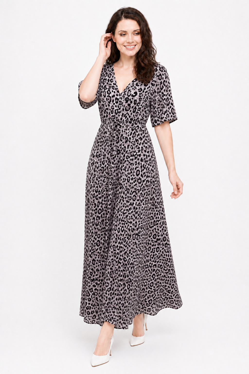Zena walking in the Avamia River Maxi Dress with a joyful expression