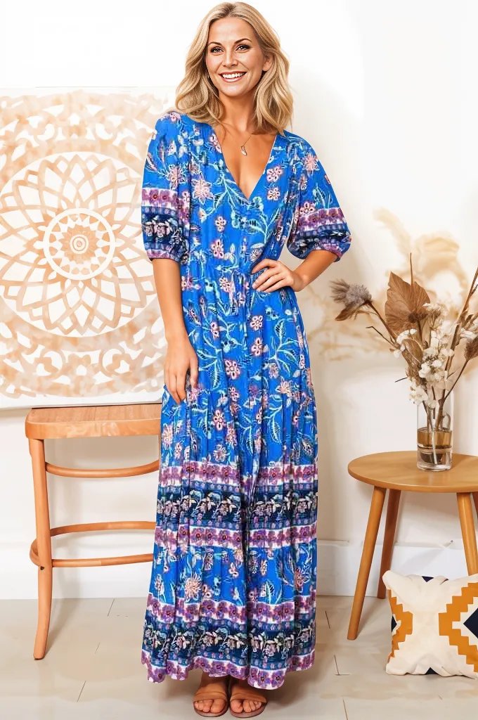 Boho Lane Australia blue floral maxi dress with a v-neck and half sleeves worn by a smiling woman