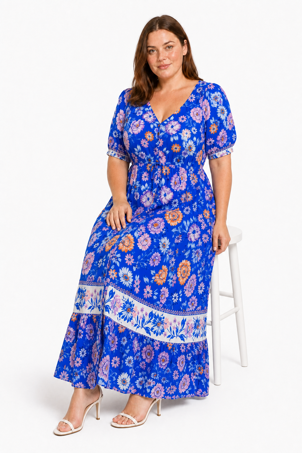 Jia seated in the Lavinia Dream blue floral maxi dress
