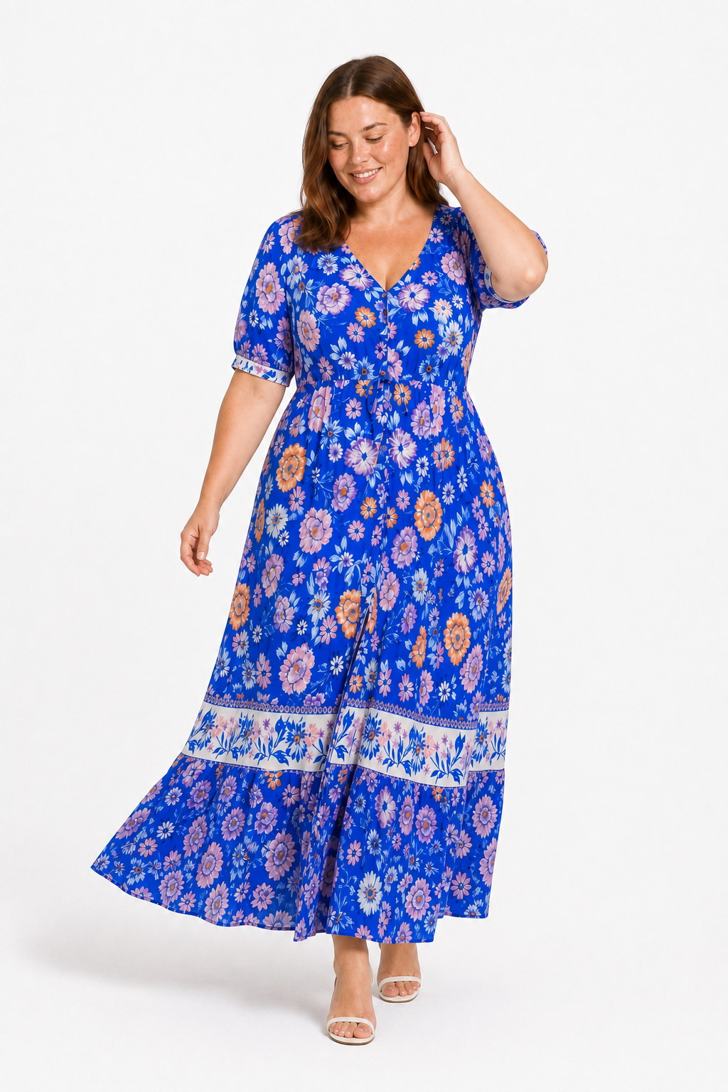 Jia walking in the Lavinia Dream blue floral maxi dress with a joyful expression