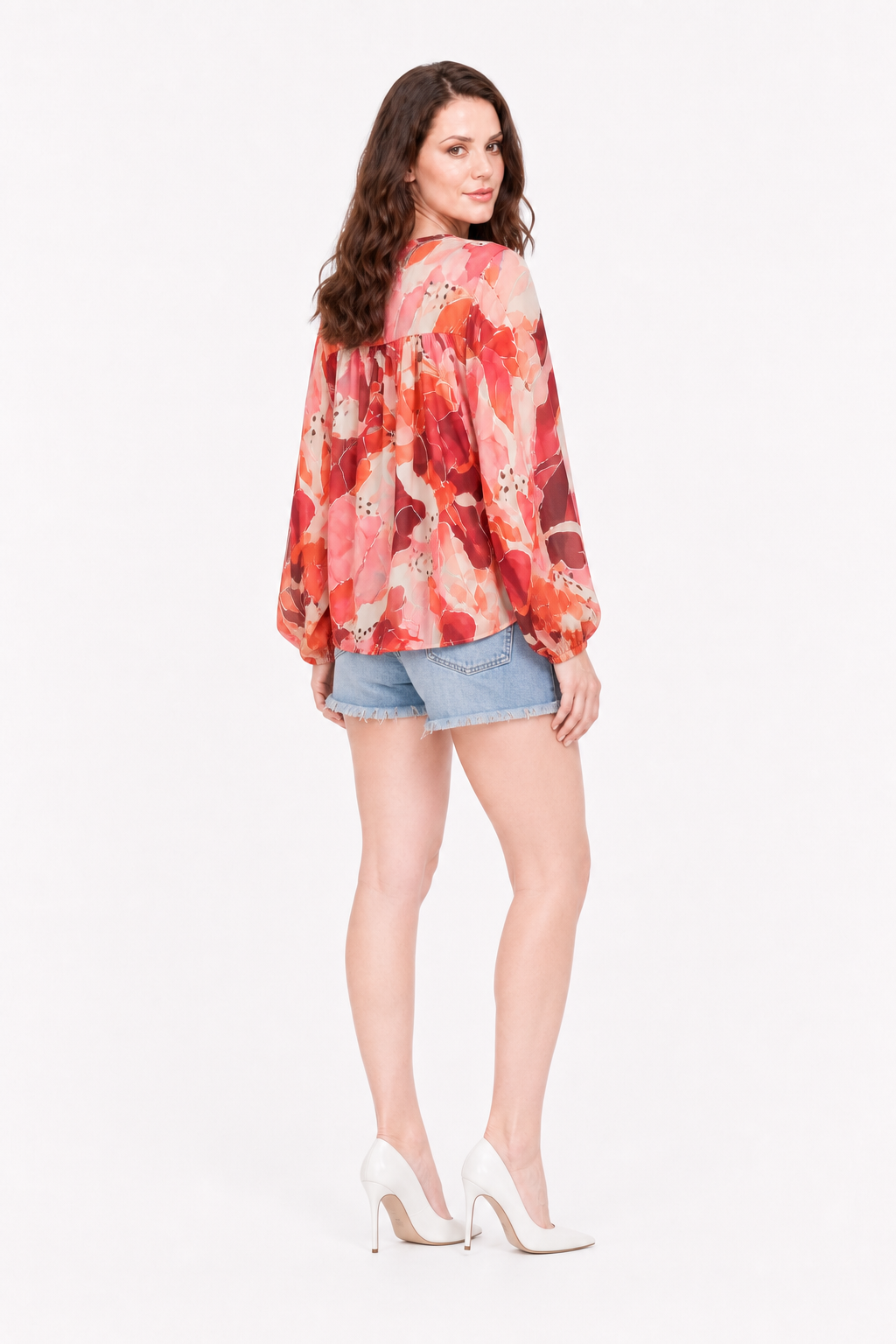 Love Me Lily floral wrap top back view showing the gathered yoke, with denim shorts and white heels.