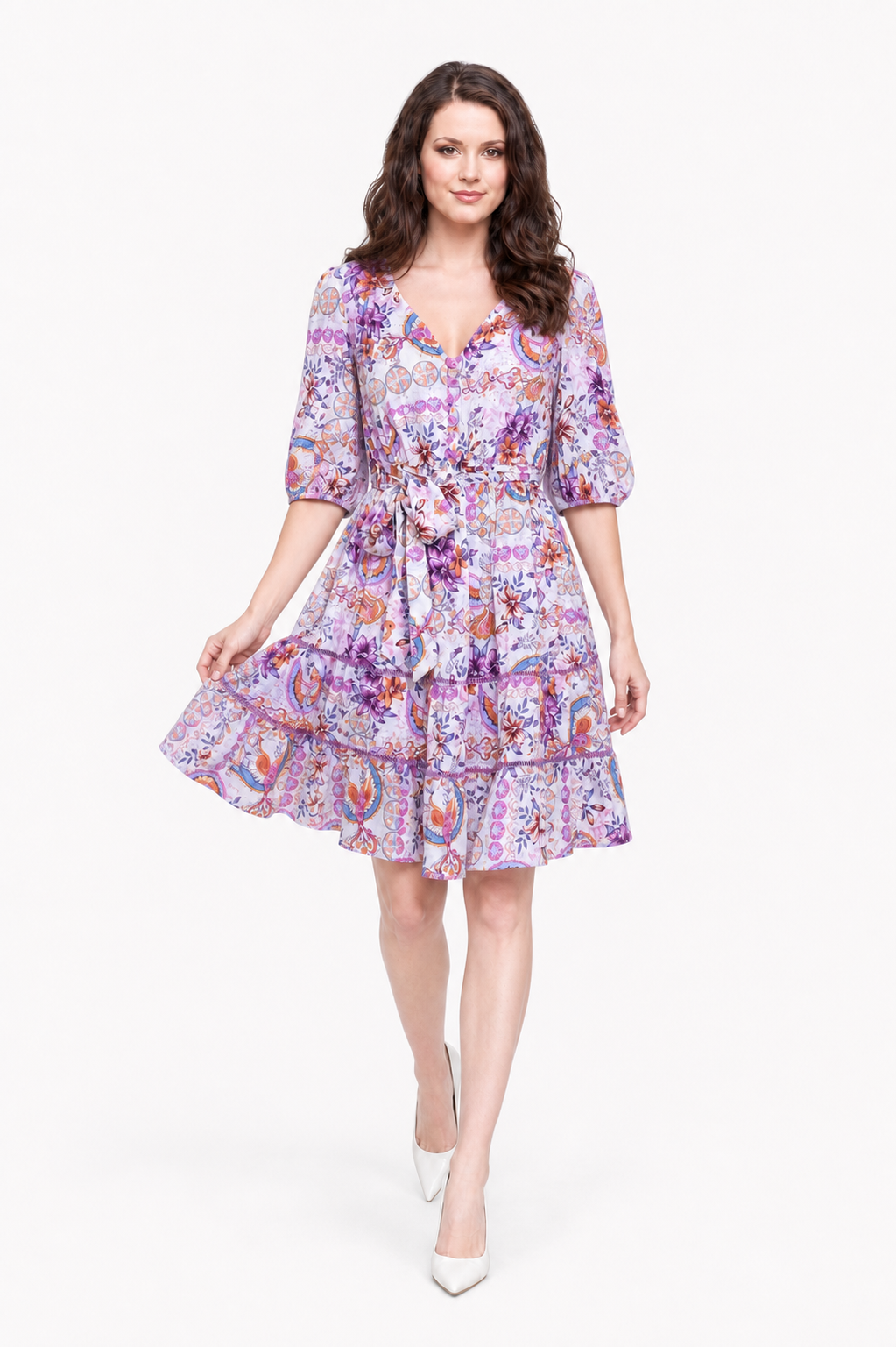 Zena wearing the Lovely Laven Mini dress walking with the skirt gently swept.