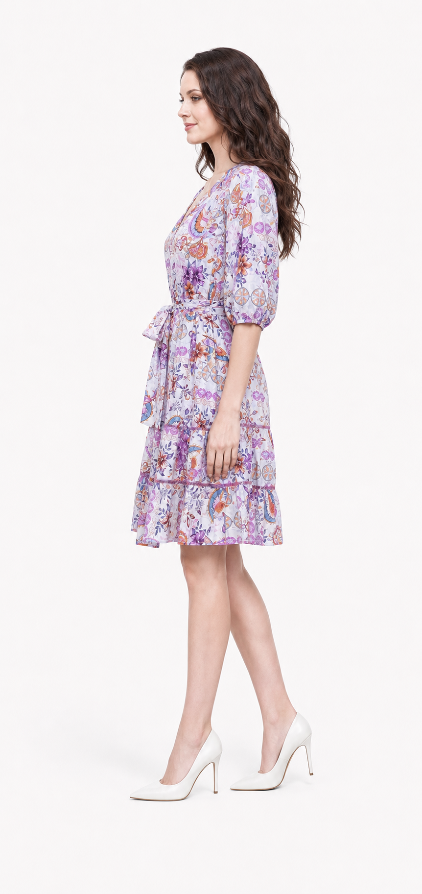 Zena wearing the Lovely Laven Mini dress in side profile.