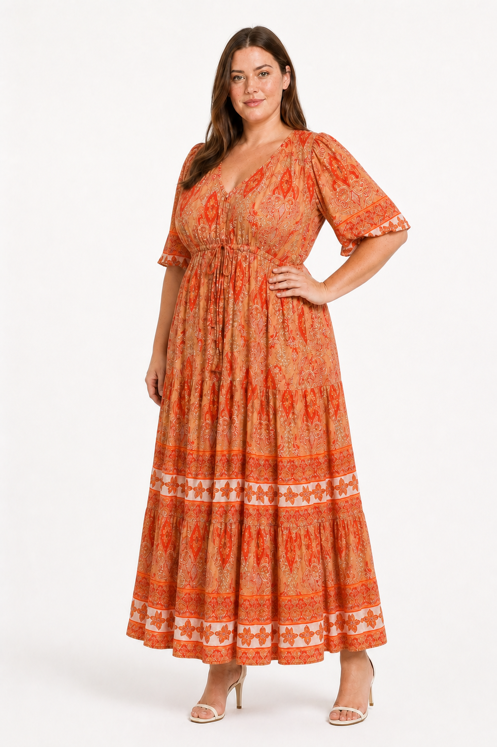 Jia wearing the Rosie Maxi in an apricot orange paisley print, three-quarter view