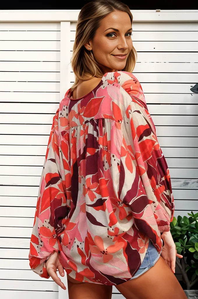 Bohemian floral wrap top by Boho Lane Australia in vibrant red and pink floral print with loose long sleeves